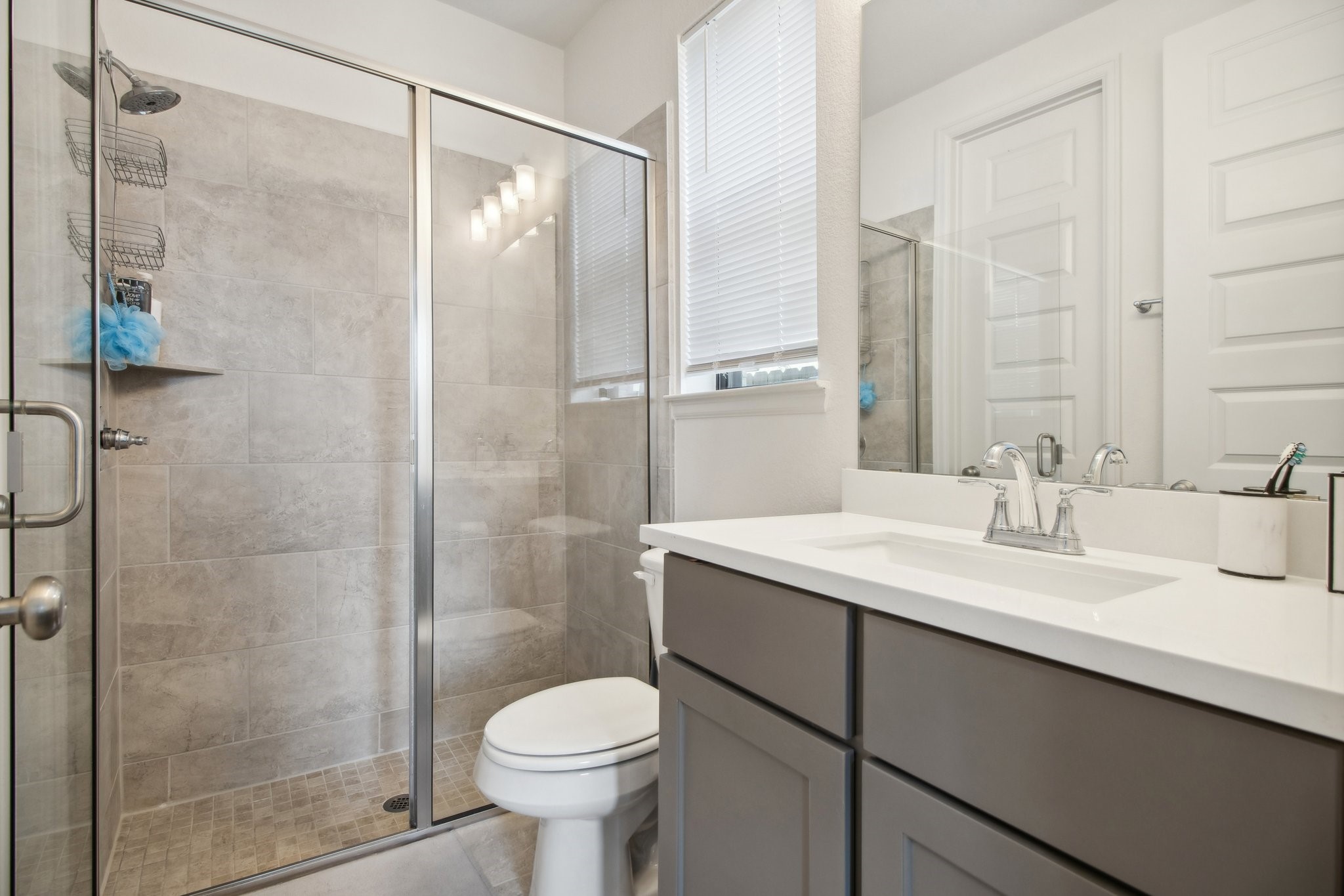 29819 Autumn Maple Court Fulshear, TX 77494 - Photo 22 of 47 a bathroom with a sink toilet a mirror and shower