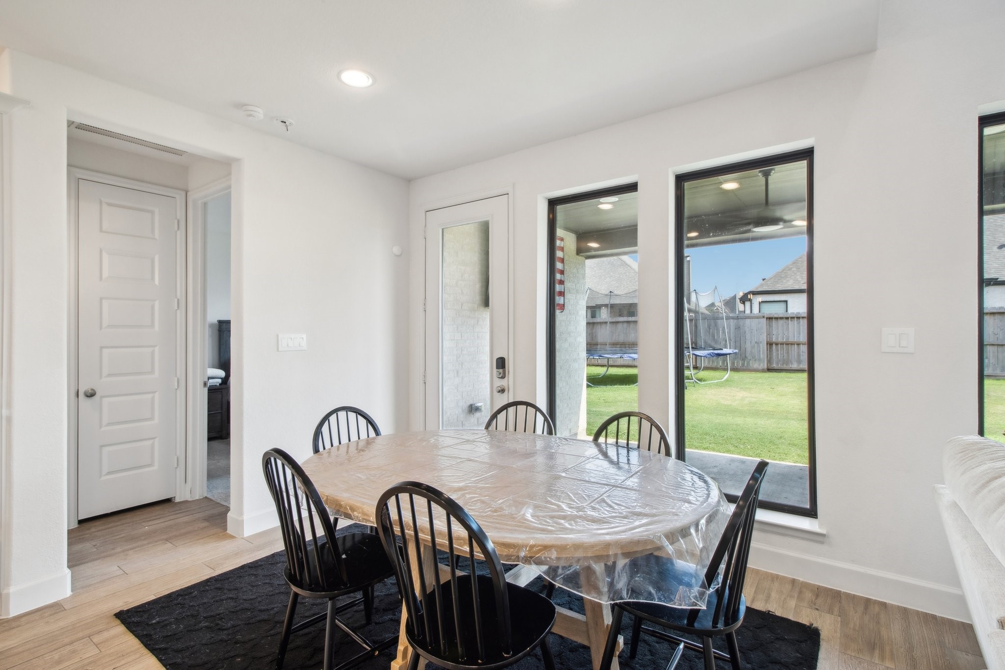29819 Autumn Maple Court Fulshear, TX 77494 - Photo 23 of 47 a view of a a dining room with furniture window and wooden floor