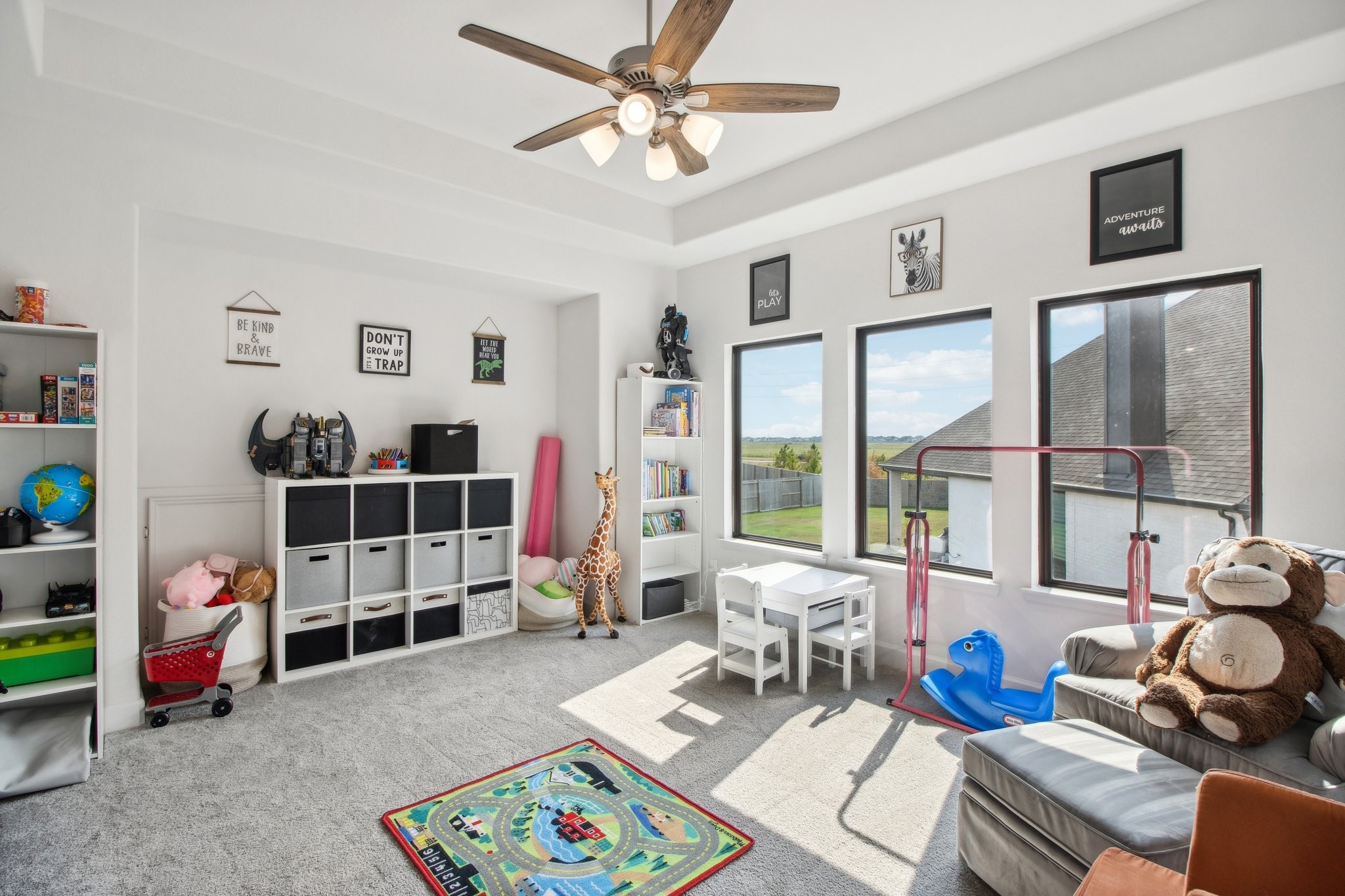 29819 Autumn Maple Court Fulshear, TX 77494 - Photo 30 of 47 a bedroom with furniture a rug toys and a window