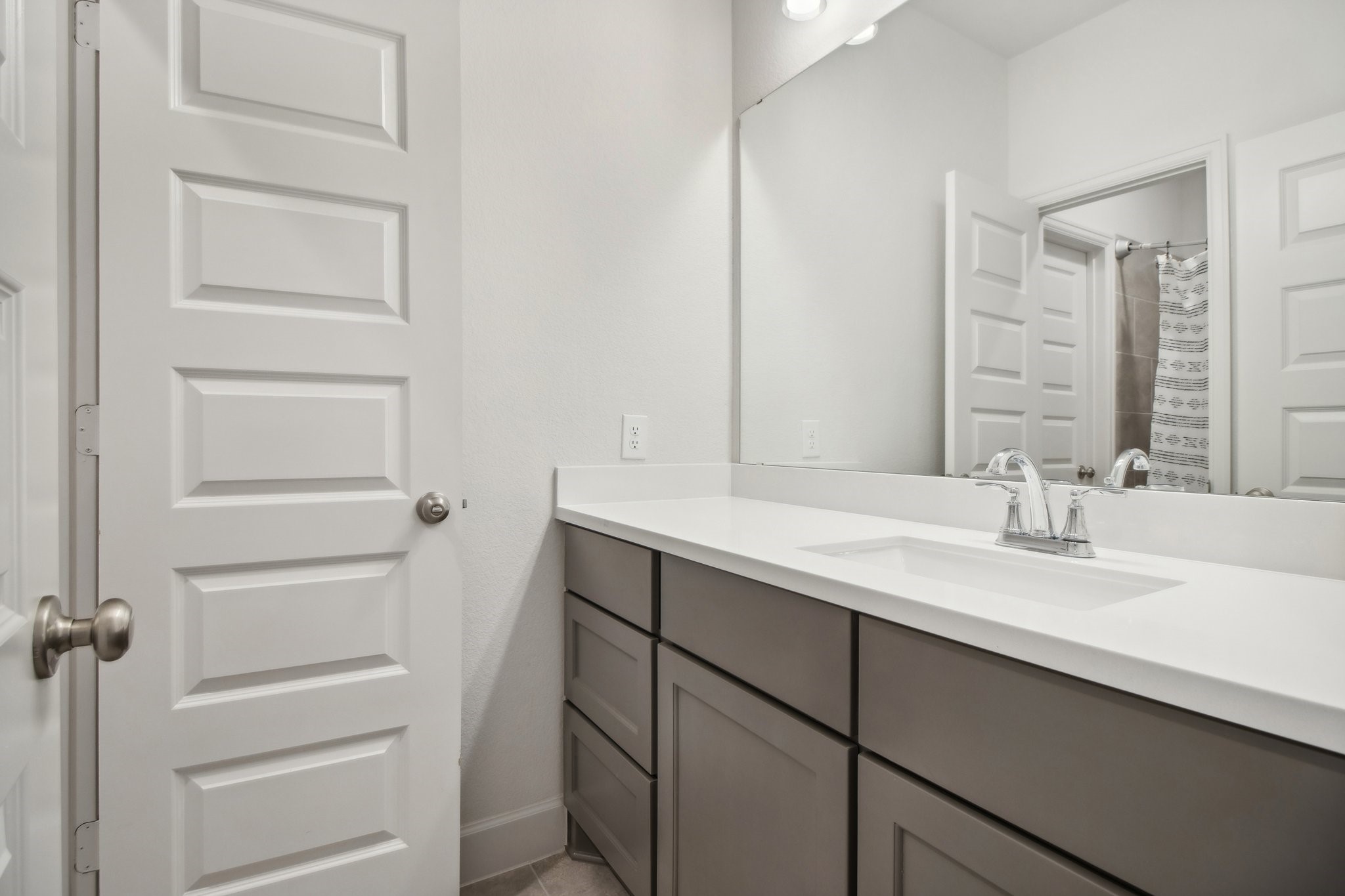 29819 Autumn Maple Court Fulshear, TX 77494 - Photo 38 of 47 a bathroom with a sink and a mirror