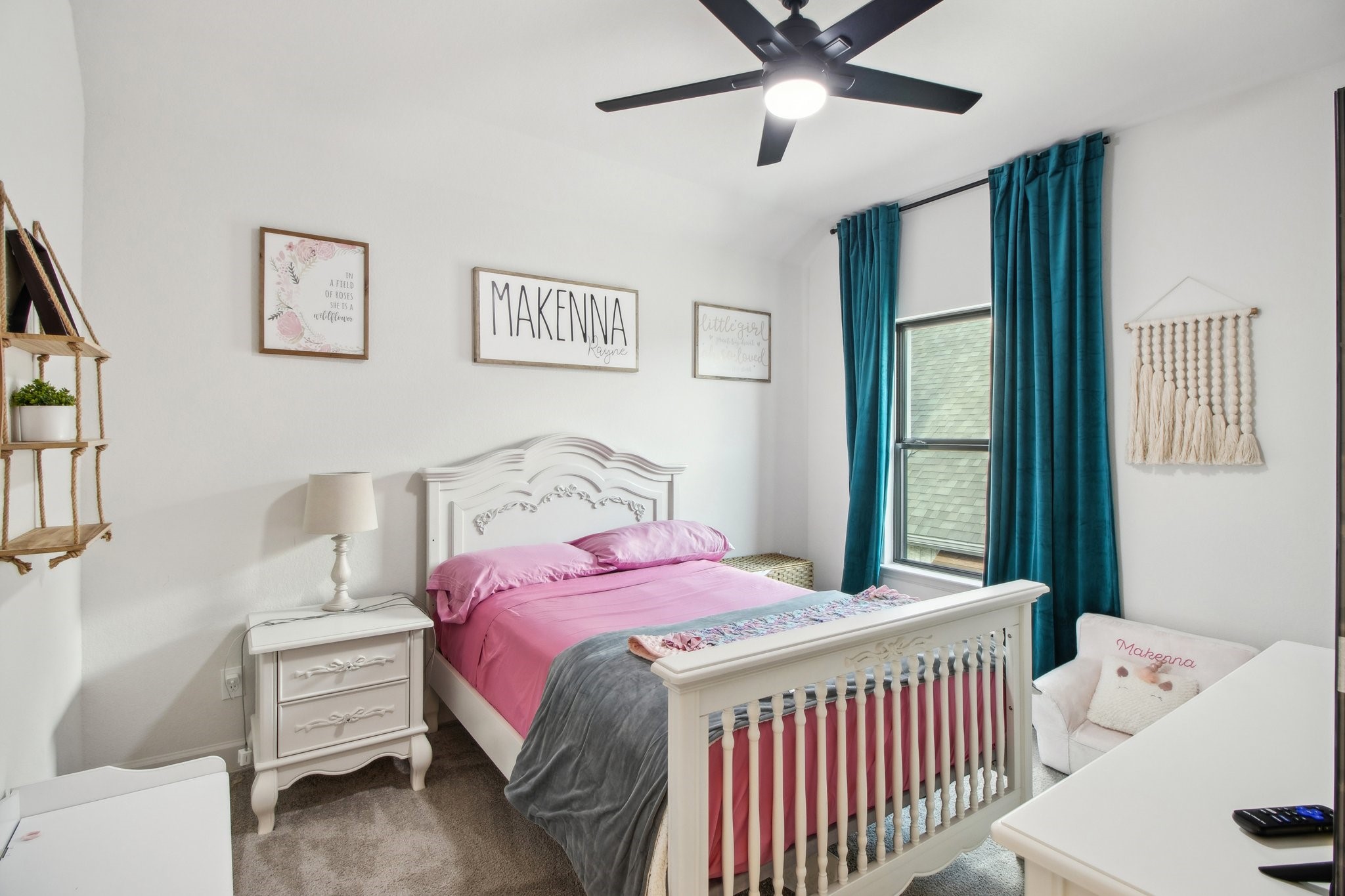 29819 Autumn Maple Court Fulshear, TX 77494 - Photo 39 of 47 a bedroom with a bed and a chandelier