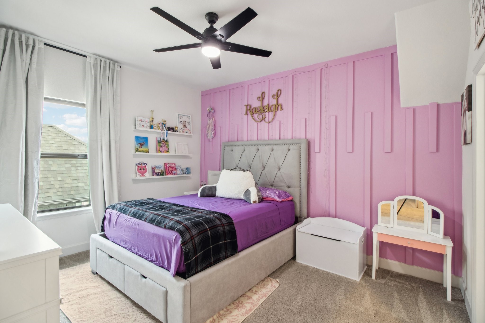 29819 Autumn Maple Court Fulshear, TX 77494 - Photo 41 of 47 a bedroom with a bed and a chandelier