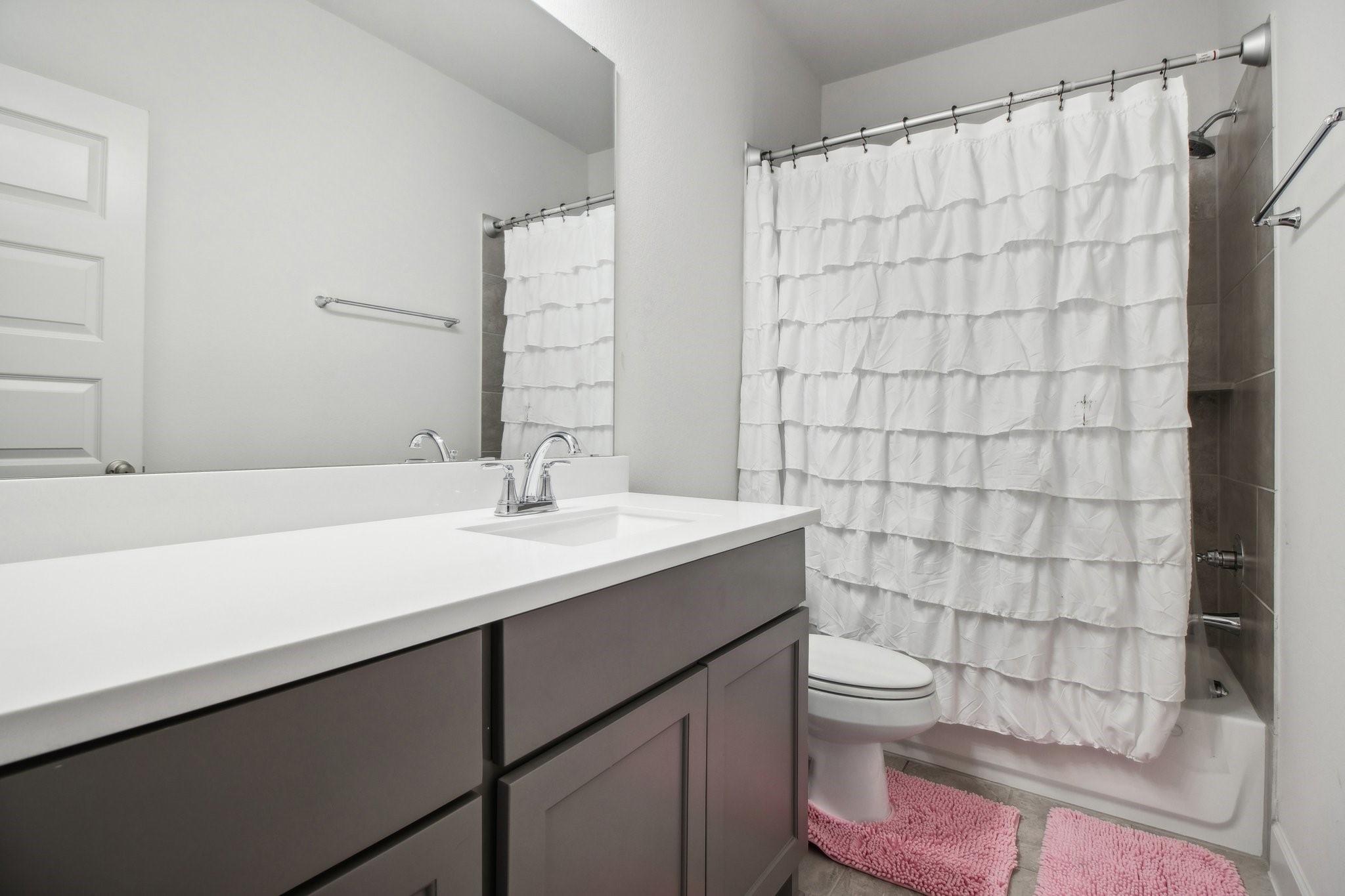 29819 Autumn Maple Court Fulshear, TX 77494 - Photo 43 of 47 a bathroom with a sink a toilet and shower curtain