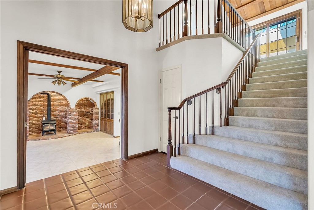 2572 Sunset Drive Riverside, CA 92506 - Photo 16 of 63 a view of staircase with a large window and a chandelier