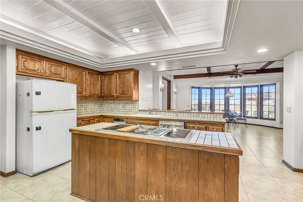 2572 Sunset Drive Riverside, CA 92506 - Photo 21 of 63 a kitchen with stainless steel appliances granite countertop a sink dishwasher stove and refrigerator with wooden floor