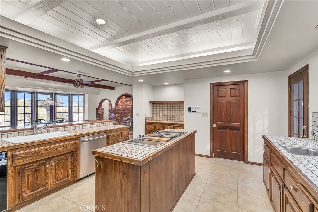 2572 Sunset Drive Riverside, CA 92506 - Photo 22 of 63 a kitchen with granite countertop a sink stove and refrigerator