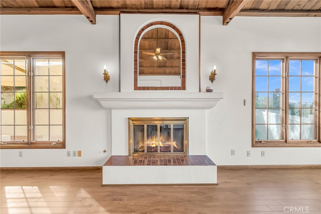 2572 Sunset Drive Riverside, CA 92506 - Photo 26 of 63 a living room with a fireplace and a large window