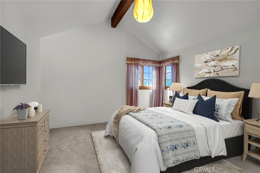 2572 Sunset Drive Riverside, CA 92506 - Photo 37 of 63 a bedroom with a bed and a chandelier