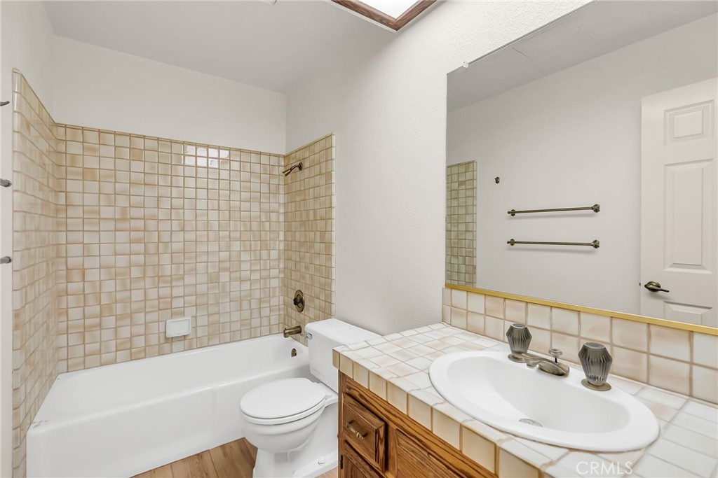 2572 Sunset Drive Riverside, CA 92506 - Photo 39 of 63 a bathroom with a sink a toilet and shower