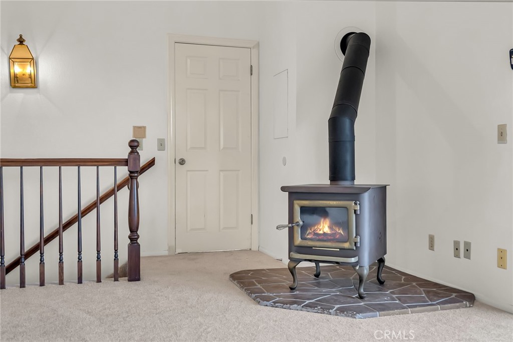 2572 Sunset Drive Riverside, CA 92506 - Photo 42 of 63 a living room with a furniture and a fireplace