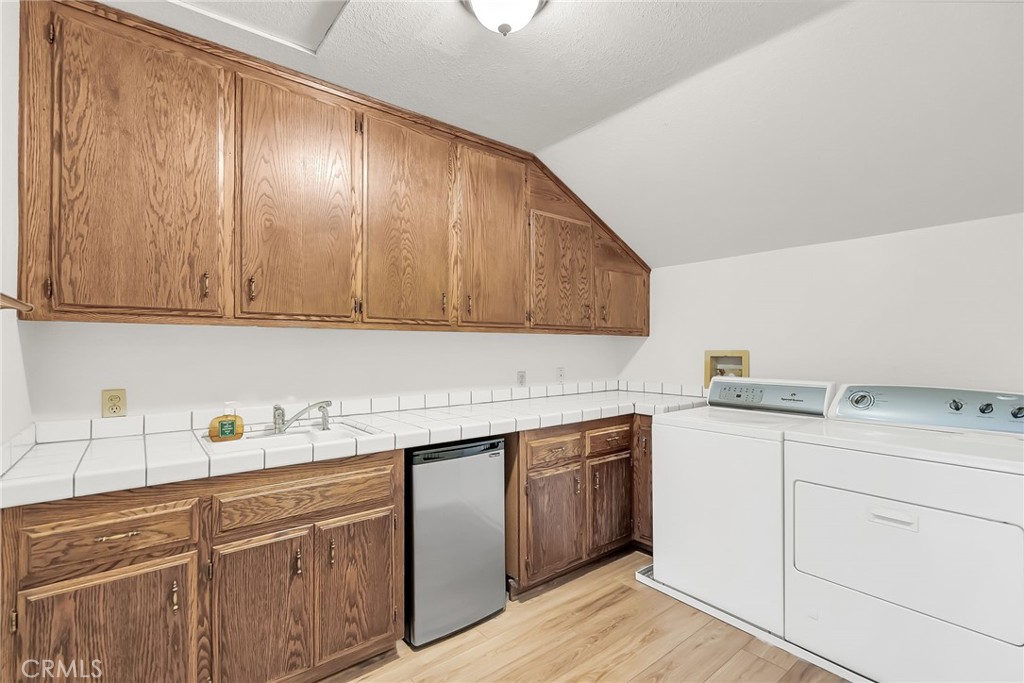 2572 Sunset Drive Riverside, CA 92506 - Photo 44 of 63 a kitchen with a sink cabinets and appliances