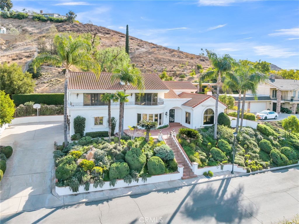 2572 Sunset Drive Riverside, CA 92506 - Photo 8 of 63 a front view of a house with a garden