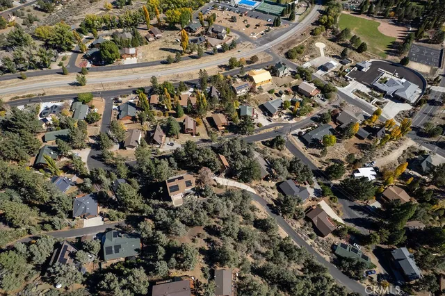 an aerial view of residential house and mountain