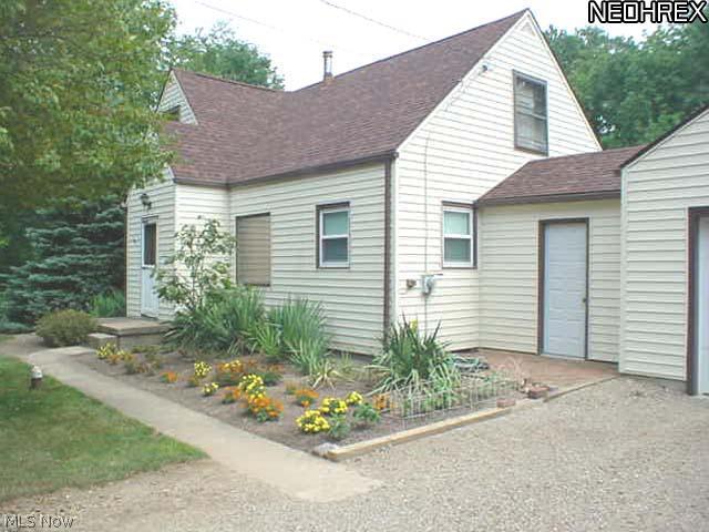 2109 Coon Road Akron, OH 44321 - Photo 2 of 12 The manicured walk leads to the entrance of the home.