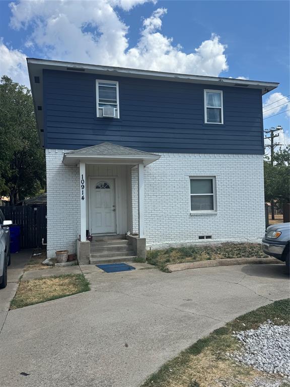 10914 Shiloh Road Dallas, TX 75228 - Photo 1 of 3 Two-story residence featuring a white brick first level and navy horizontal siding on the second level