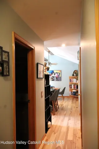 a spacious bedroom with a bed and a window