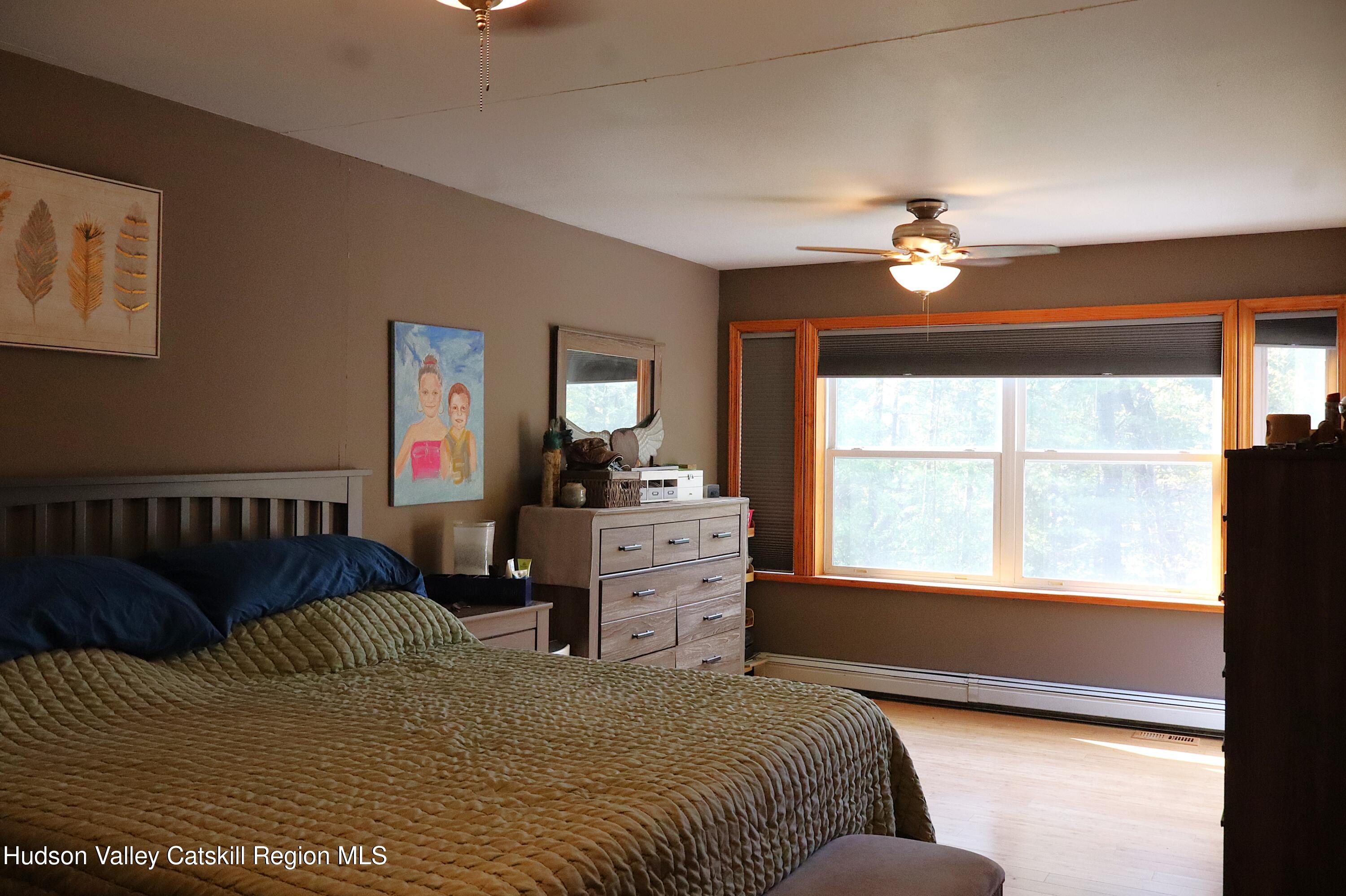 132 Dutchtown Road Saugerties, NY 12477 - Photo 20 of 45 a spacious bedroom with a bed and a window