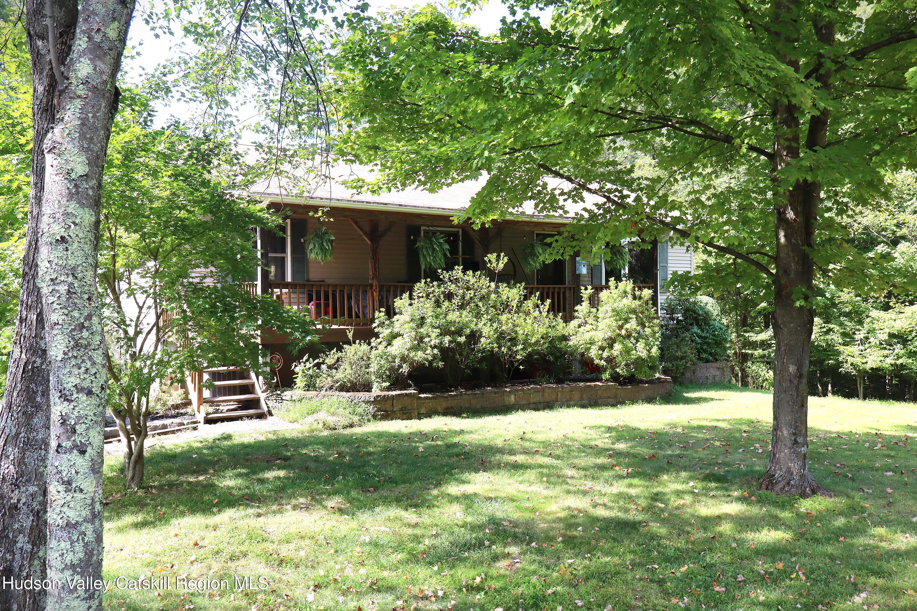 132 Dutchtown Road Saugerties, NY 12477 - Photo 2 of 45 a view of a yard with plants and large trees