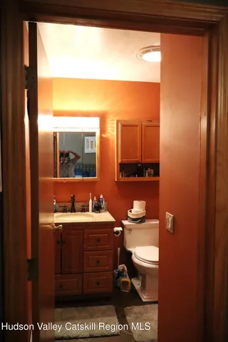 a bathroom with a sink a vanity and a mirror