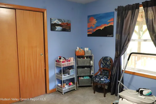 a view of a house with a yard and street