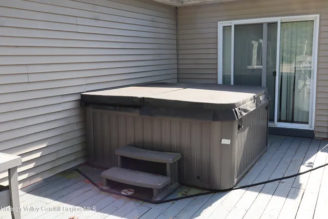 a view of a balcony with wooden fence