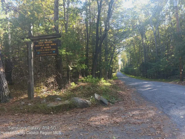 a view of a house with a tree