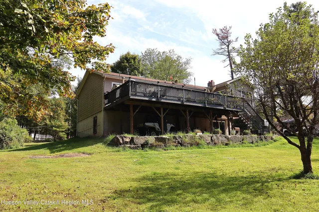 a front view of house with yard and seating area