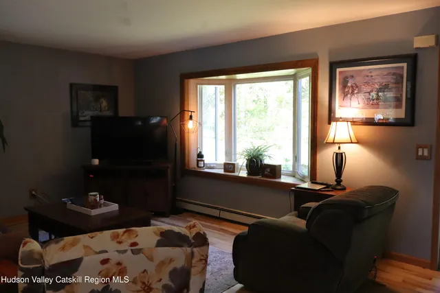 a living room with furniture and a window