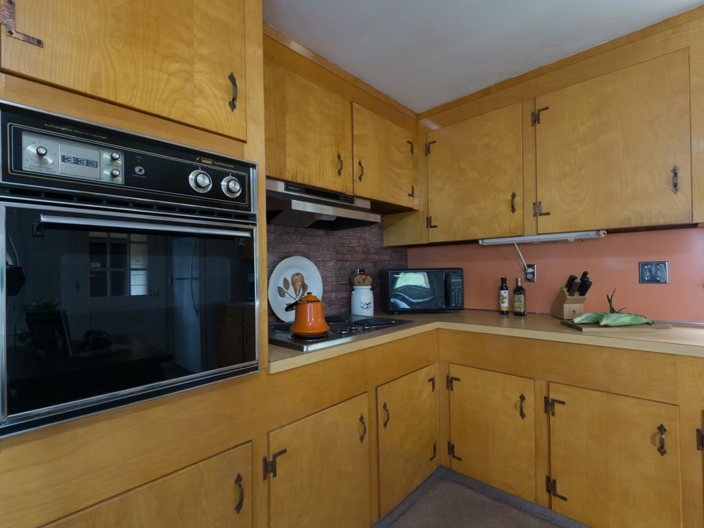 91 Carlyle Road Portland, ME 04103 - Photo 6 of 27 The kitchen features a brick...