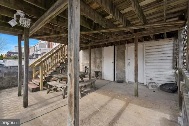 a view of a porch with seating space