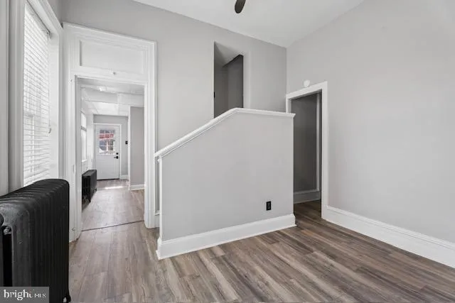 a view of livingroom with hardwood floor and hallway