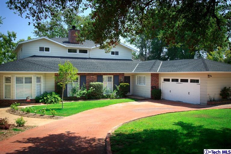 3830 Shadow Grove Road Pasadena, CA 91107 - Photo 1 of 31 a front view of a house with a yard and garage