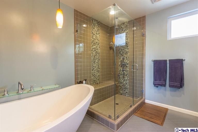 3830 Shadow Grove Road Pasadena, CA 91107 - Photo 22 of 31 a bathroom with a bathtub and shower