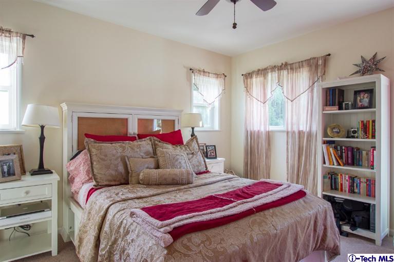 3830 Shadow Grove Road Pasadena, CA 91107 - Photo 23 of 31 a bedroom with a bed and a book shelf