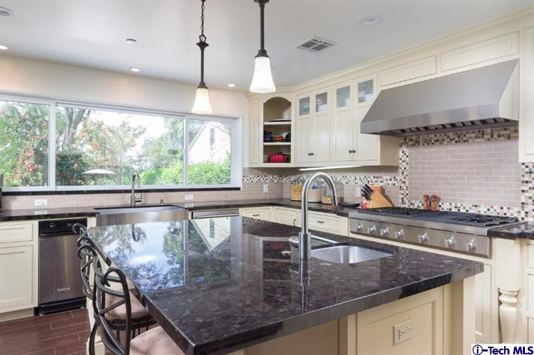 3830 Shadow Grove Road Pasadena, CA 91107 - Photo 10 of 31 a kitchen with stainless steel appliances granite countertop a sink a stove and a wooden cabinets