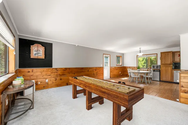 a bedroom with a bed and a baby crib