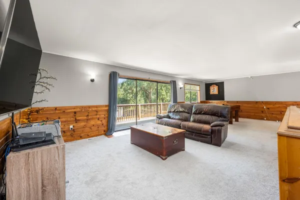 a bedroom with a bed dresser and a window