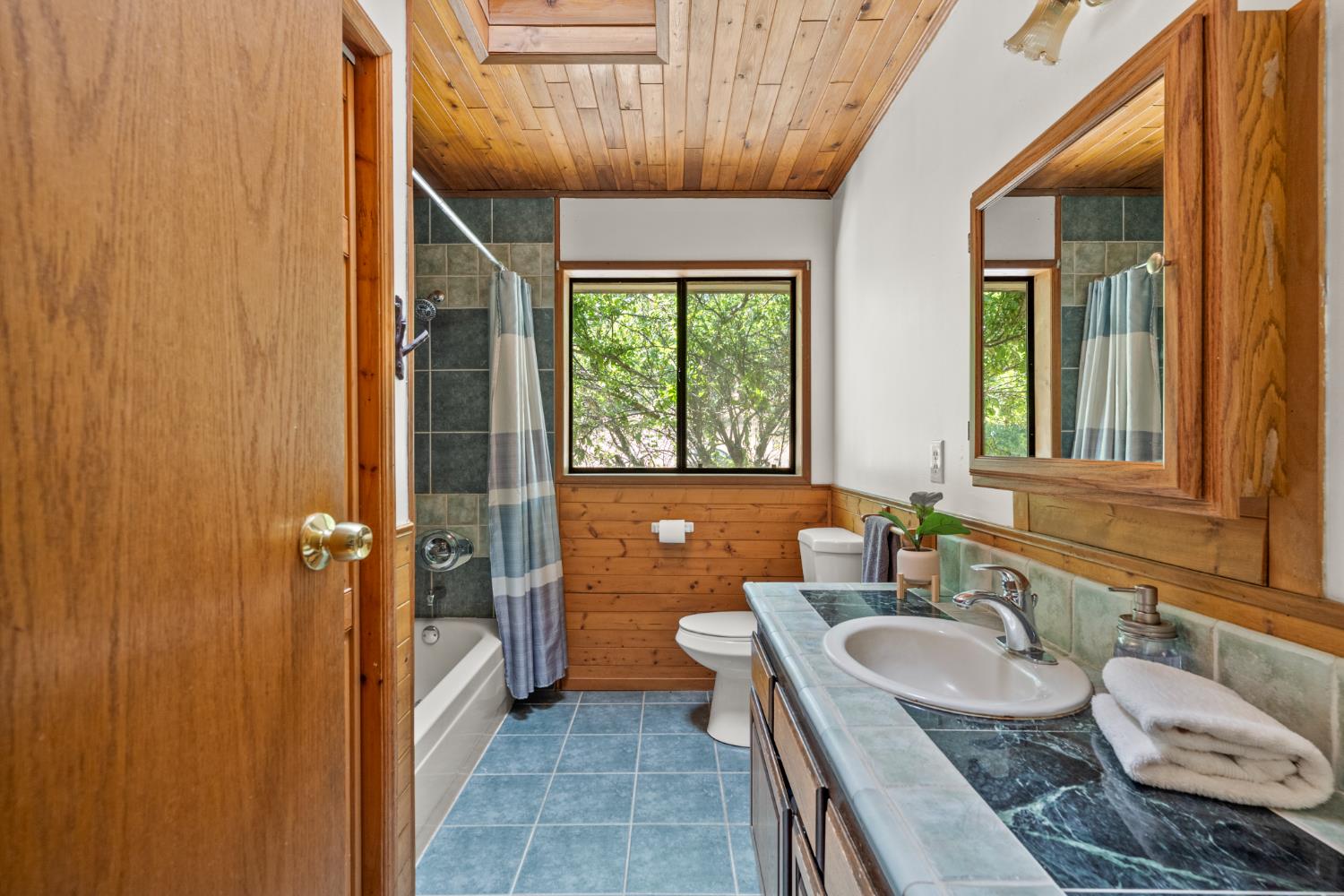 2162 Painted Pony Road Somerset, CA 95684 - Photo 19 of 72 a bathroom with a granite countertop sink and a mirror