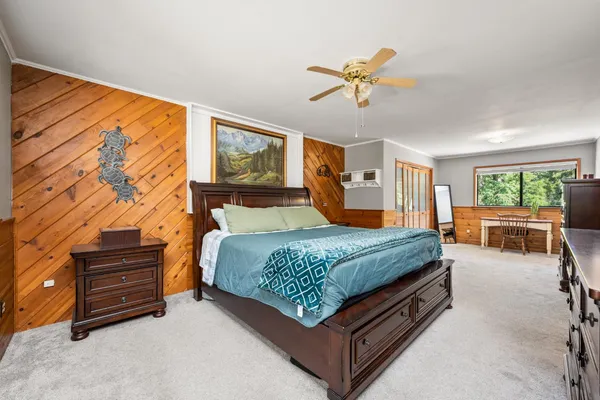 a view of balcony with wooden floor and fence