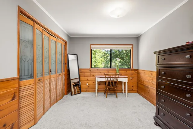 a view of balcony with wooden floor and fence
