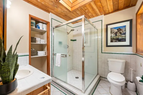 a kitchen with a refrigerator and a sink