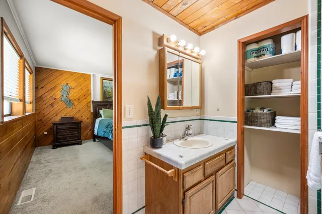 a kitchen with a refrigerator and a sink