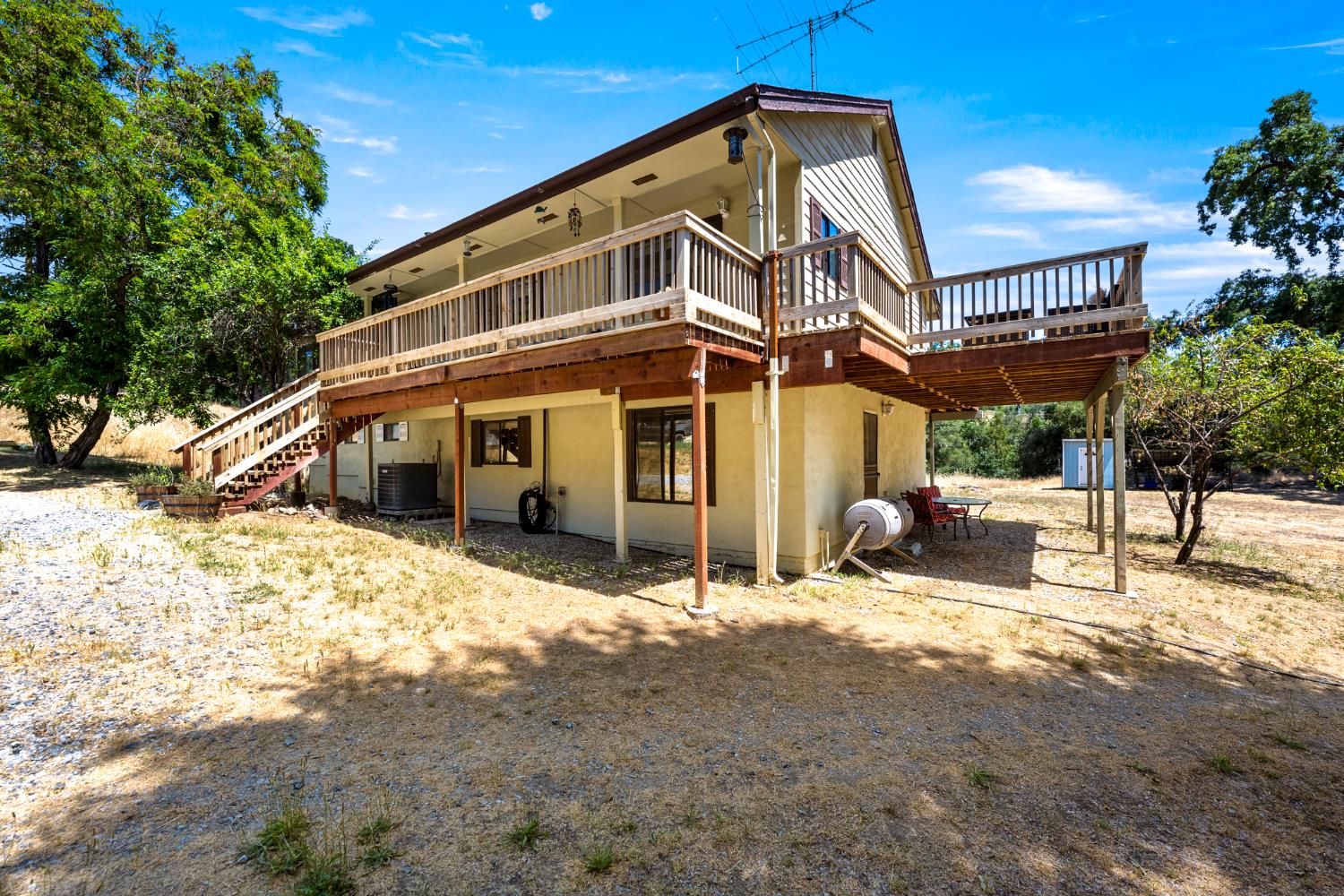 2162 Painted Pony Road Somerset, CA 95684 - Photo 31 of 72 a view of a house with a big yard and sitting area