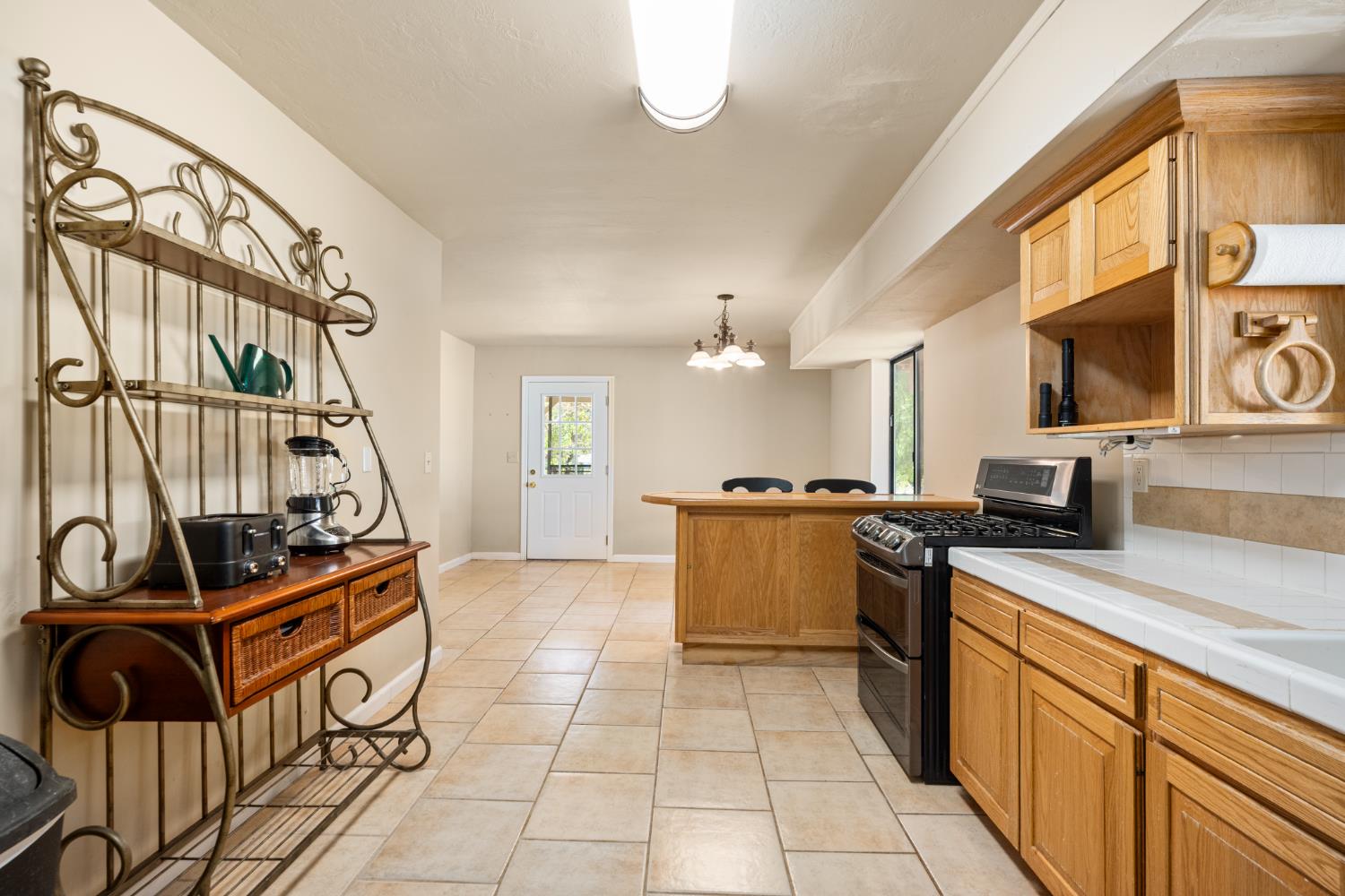 2162 Painted Pony Road Somerset, CA 95684 - Photo 36 of 72 a kitchen with stainless steel appliances granite countertop a stove and a sink