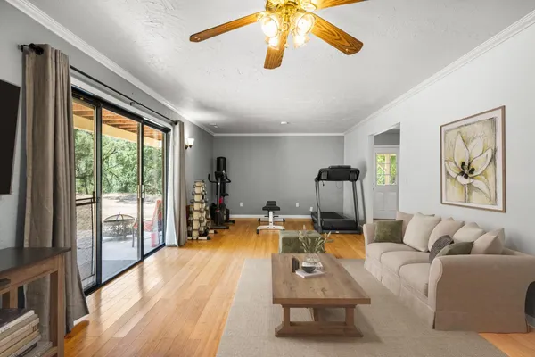 a backyard of a house with fountain and outdoor seating