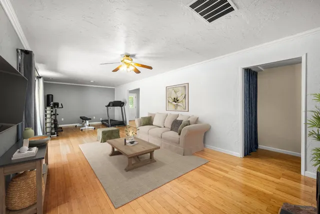 a backyard of a house with fountain and outdoor seating