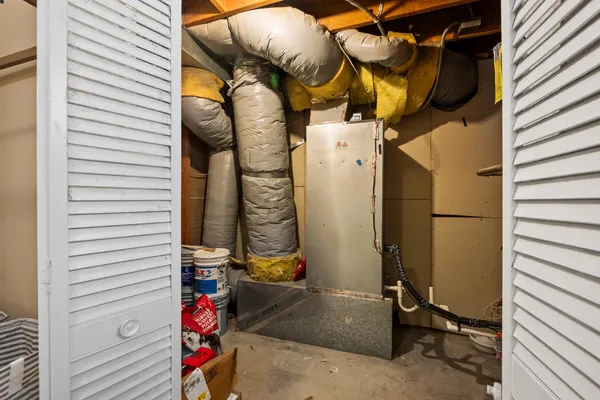 a roof deck with table and chairs a barbeque with potted plants