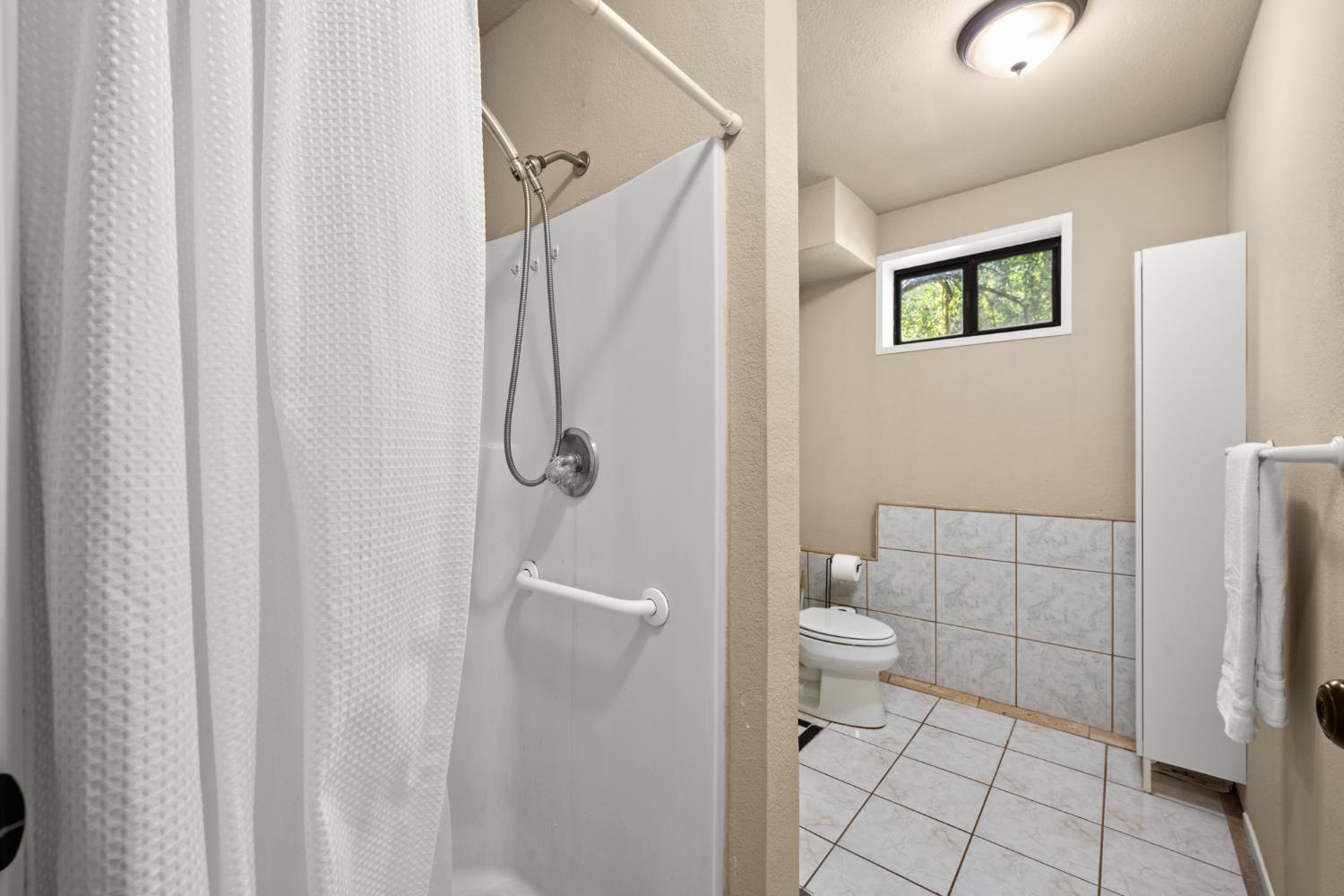 2162 Painted Pony Road Somerset, CA 95684 - Photo 45 of 72 a bathroom with a shower and toilet