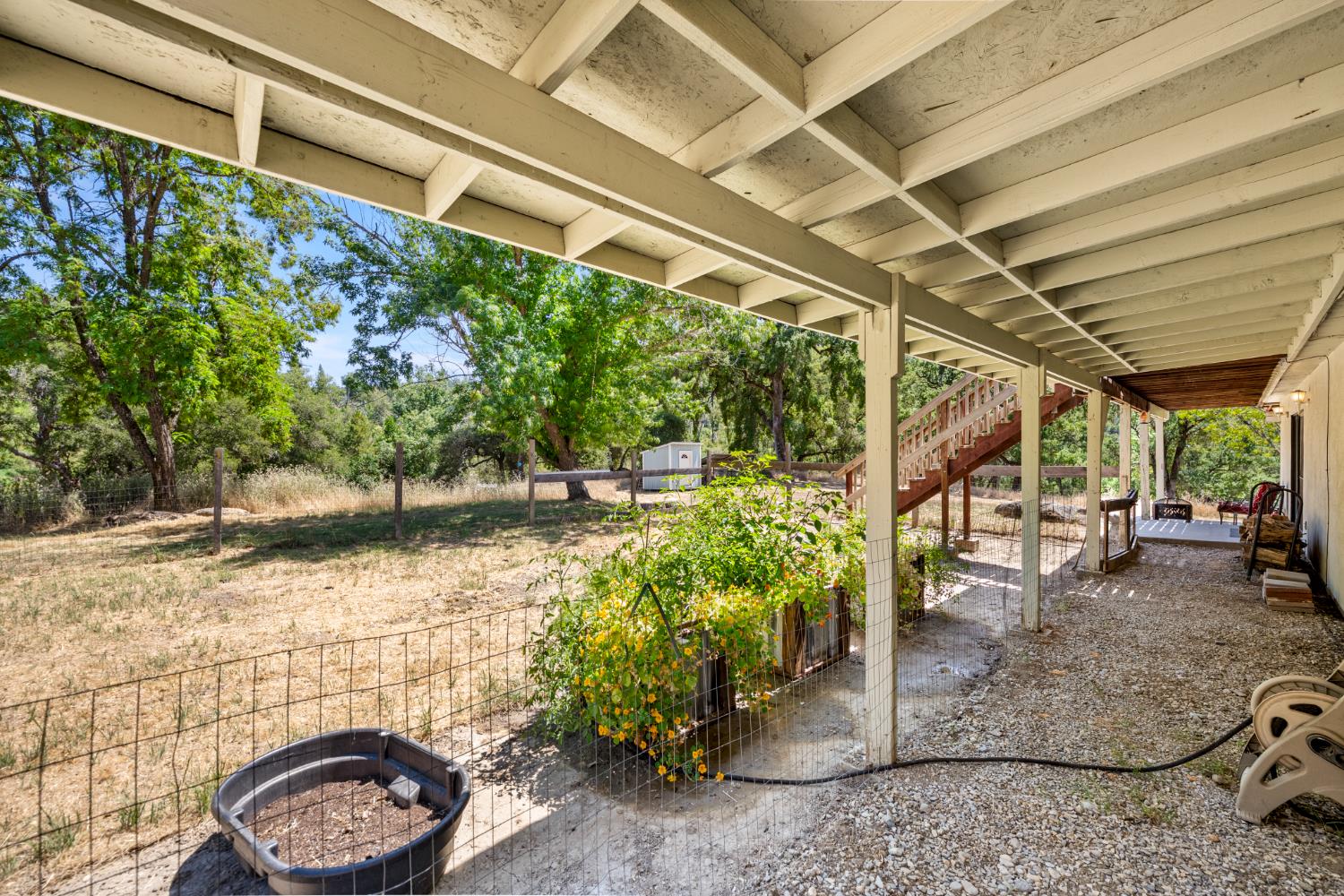 2162 Painted Pony Road Somerset, CA 95684 - Photo 53 of 72 a backyard of a house with fountain and outdoor seating