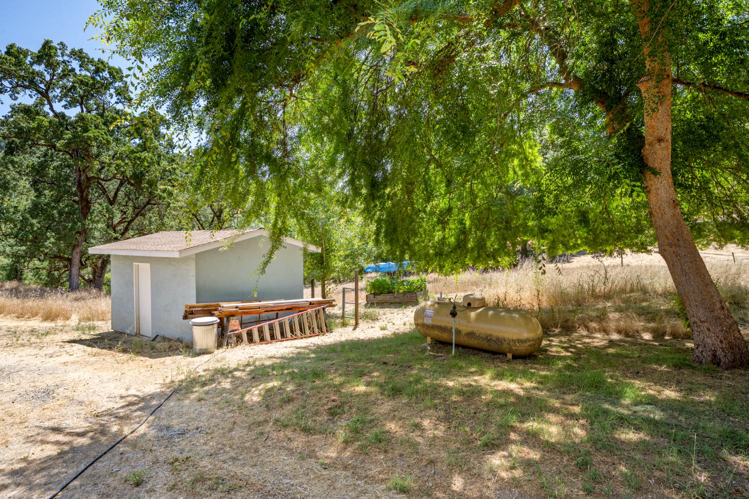 2162 Painted Pony Road Somerset, CA 95684 - Photo 57 of 72 a roof deck with table and chairs a barbeque with potted plants
